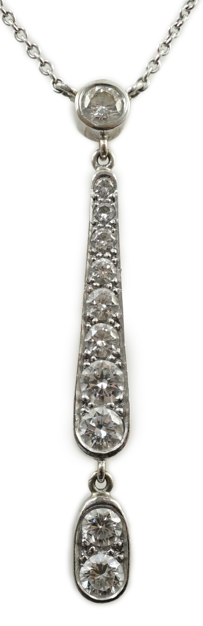 A modern 18ct white gold and graduated eleven stone diamond set drop pendant necklace